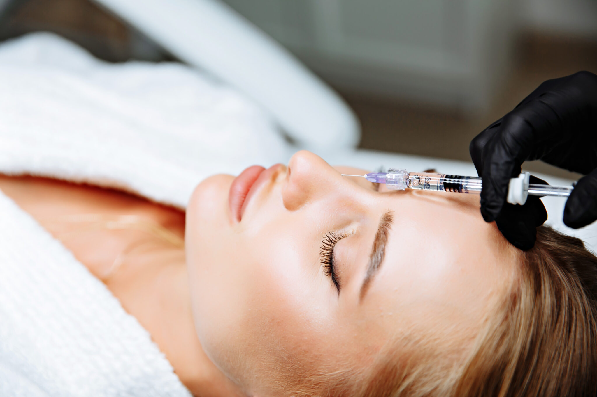 woman receiving nose filler in charlotte